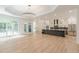 Bright, spacious living area leading to modern kitchen with a large kitchen island at 6394 Wood Valley Rd, Douglasville, GA 30134