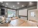 Spacious living room boasts a large screen and access to the outdoors at 6394 Wood Valley Rd, Douglasville, GA 30134