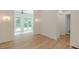 Bright living room featuring large windows, hardwood floors and neutral paint at 6394 Wood Valley Rd, Douglasville, GA 30134