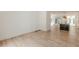 Bright living space with hardwood floors leading to the kitchen at 6394 Wood Valley Rd, Douglasville, GA 30134