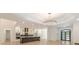 Open-concept living space leading to a modern kitchen with stainless steel appliances at 6394 Wood Valley Rd, Douglasville, GA 30134
