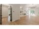 Open living space featuring wood floors, modern lighting, and a sleek fireplace at 6394 Wood Valley Rd, Douglasville, GA 30134
