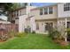 Beautiful backyard featuring a well-maintained lawn and flourishing flowers at 1911 Stancrest Nw Trce, Kennesaw, GA 30152