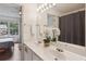 Bathroom with dual sinks, mirror, and shower at 1911 Stancrest Nw Trce, Kennesaw, GA 30152