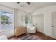 Large bedroom with dresser and recliner at 1911 Stancrest Nw Trce, Kennesaw, GA 30152