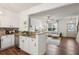 Open kitchen view showcasing hardwood floors and seamless transition to the living area at 1911 Stancrest Nw Trce, Kennesaw, GA 30152