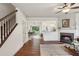 Spacious living area adjacent to the dining area, offering hardwood floors and staircase access at 1911 Stancrest Nw Trce, Kennesaw, GA 30152