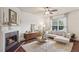 Cozy living room boasts a fireplace, hardwood floors, and comfortable furnishings at 1911 Stancrest Nw Trce, Kennesaw, GA 30152