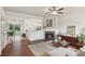 Open concept living room flowing into kitchen, featuring a fireplace and hardwood floors at 1911 Stancrest Nw Trce, Kennesaw, GA 30152