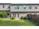 Backyard features a well-maintained lawn, privacy fence, and the exterior of the home at 2725 Morgan Glen Rd, Buford, GA 30519
