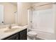 Bathroom featuring vanity sink with dark wood cabinets and shower at 2725 Morgan Glen Rd, Buford, GA 30519