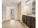 Bathroom featuring tile floors, a double vanity, and an open doorway to another room at 2725 Morgan Glen Rd, Buford, GA 30519