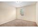 Cozy bedroom featuring neutral walls and a sunlit window view at 2725 Morgan Glen Rd, Buford, GA 30519