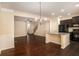 Open dining space with hardwood floors adjacent to the kitchen area at 2725 Morgan Glen Rd, Buford, GA 30519