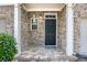 Front door of brick townhome with white columns and traditional design at 2725 Morgan Glen Rd, Buford, GA 30519