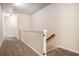 Carpeted hallway with access to stairs and a nearby room at 2725 Morgan Glen Rd, Buford, GA 30519