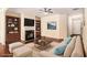 Staged living room showcasing a fireplace, built-in shelves, and hardwood floors at 2725 Morgan Glen Rd, Buford, GA 30519