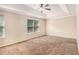 Spacious main bedroom featuring tray ceiling and natural light from two windows at 2725 Morgan Glen Rd, Buford, GA 30519