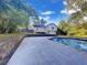 Relaxing backyard featuring a refreshing swimming pool, spacious patio, and lush landscaping at 2955 Terry Sw Ln, Marietta, GA 30064
