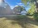 Spacious backyard with a deck, ample green space, and mature trees at 2955 Terry Sw Ln, Marietta, GA 30064
