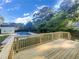 Lovely backyard featuring a deck, swimming pool, and plenty of trees at 2955 Terry Sw Ln, Marietta, GA 30064
