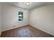 Relaxing bedroom featuring neutral walls, carpeting, and a window view at 2955 Terry Sw Ln, Marietta, GA 30064