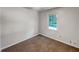 Cozy bedroom featuring neutral walls, carpeting, and a window view at 2955 Terry Sw Ln, Marietta, GA 30064