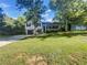 Charming two-story home featuring a well-manicured lawn, inviting front porch, and attached garage at 2955 Terry Sw Ln, Marietta, GA 30064