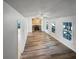 Bright living room featuring hardwood floors, a fireplace, and many windows at 2955 Terry Sw Ln, Marietta, GA 30064