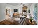 Bright living room boasts stylish decor, a stone fireplace, and seamless access to the adjacent kitchen at 2955 Terry Sw Ln, Marietta, GA 30064