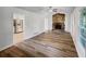 The living room features a stone fireplace and sleek hardwood flooring, adjacent to the kitchen at 2955 Terry Sw Ln, Marietta, GA 30064