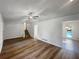 Open living room featuring hardwood floors, a ceiling fan, and staircase at 2955 Terry Sw Ln, Marietta, GA 30064