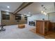 Finished basement with a bar area, built-in shelving, and entertainment space at 3300 Wiltshire Dr, Avondale Estates, GA 30002