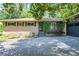 Charming brick home featuring a well-maintained yard and attached garage at 3300 Wiltshire Dr, Avondale Estates, GA 30002
