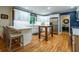 Bright, updated kitchen with white cabinetry, breakfast bar, and stainless steel appliances at 3300 Wiltshire Dr, Avondale Estates, GA 30002
