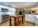Bright kitchen featuring white cabinetry, stainless steel appliances, butcher block island, and hardwood flooring at 3300 Wiltshire Dr, Avondale Estates, GA 30002