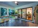 Tiled sunroom featuring lots of natural light, views of the outdoors, and access to the backyard at 3300 Wiltshire Dr, Avondale Estates, GA 30002