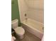 Bathroom featuring a white tub with tile backsplash and green wall at 3515 Shepherds Path, Decatur, GA 30034