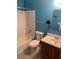 Bathroom with blue walls, shower and tub combo with white tile at 3515 Shepherds Path, Decatur, GA 30034