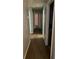 Neutral hallway with carpeted floor and several white doors leading to rooms in the home at 3515 Shepherds Path, Decatur, GA 30034