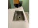 Close-up of kitchen sink with stainless steel faucet and quartz countertop at 3515 Shepherds Path, Decatur, GA 30034
