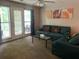 Inviting living room with a view of the outdoor patio seating and decor at 3515 Shepherds Path, Decatur, GA 30034