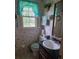 Cozy bathroom with tile floors, floral wallpaper, and classic fixtures at 529 Valley Woods Se Cir, Conyers, GA 30094