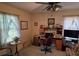 Comfortable bedroom with windows allowing lots of natural light and ceiling fan at 529 Valley Woods Se Cir, Conyers, GA 30094