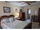 Cozy bedroom showcasing matching wood furniture set and relaxing neutral tones at 529 Valley Woods Se Cir, Conyers, GA 30094