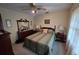 A serene bedroom with wood accents, soft lighting, and comfortable furnishings at 529 Valley Woods Se Cir, Conyers, GA 30094
