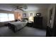 Inviting bedroom featuring wood furniture, soft carpeting, and natural light at 529 Valley Woods Se Cir, Conyers, GA 30094