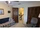 Bedroom features functional layout with desk, adjacent sitting area, and closet access at 529 Valley Woods Se Cir, Conyers, GA 30094