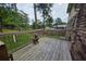 This backyard deck features wood flooring with railing overlooking the lawn at 529 Valley Woods Se Cir, Conyers, GA 30094