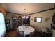 This dining room features an elegant chandelier, hutch and seating for six around a circular table at 529 Valley Woods Se Cir, Conyers, GA 30094